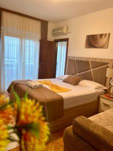a bedroom with a large bed in a room at Apartments Gazi in Ulcinj