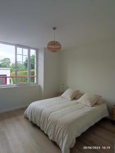 Ένα ή περισσότερα κρεβάτια σε δωμάτιο στο Gîte classé 4 étoiles Mulhoa