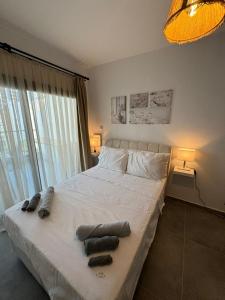 Ένα ή περισσότερα κρεβάτια σε δωμάτιο στο Siesta Summer House - Long Beach İskele +12 φωτογραφίες