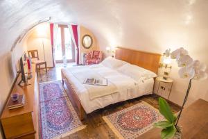 Postel nebo postele na pokoji v ubytování Corte Realdi Suites Piazza Erbe
