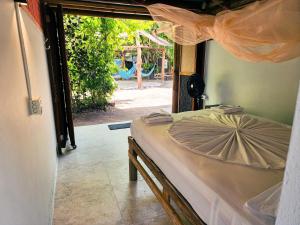 Postel nebo postele na pokoji v ubytování El Hamaquero Hostal EcoNativo