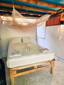 Postel nebo postele na pokoji v ubytování El Hamaquero Hostal EcoNativo