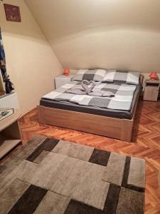 A bed or beds in a room at Ágnes Pihenőház