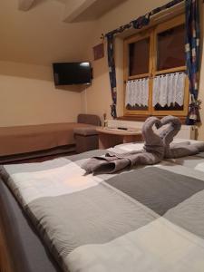 A bed or beds in a room at Ágnes Pihenőház