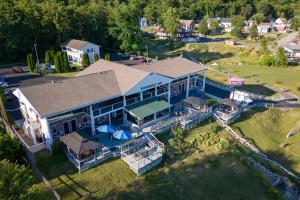an aerial view of a large house with a porch at Riverboat Inn & Suites in Madison