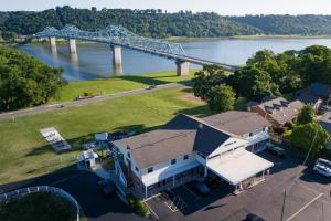an aerial view of a house with a bridge in the background at Riverboat Inn & Suites in Madison