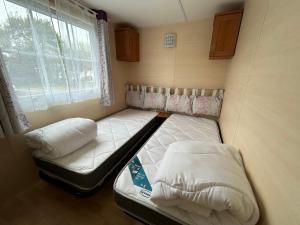 Ένα ή περισσότερα κρεβάτια σε δωμάτιο στο Mobil Home Bord de Mer