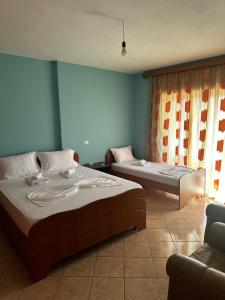 Giường trong phòng chung tại Boni Apartments