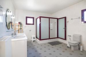 a bathroom with a toilet sink and a shower at Villa Aelia Luxury Maisonette in Salamina