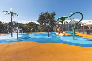 a water park with a playground with slides and a water slide at Haven, Cala Gran caravan park, privately owned in Blackpool