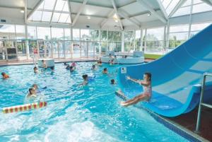 a group of people in a swimming pool at Haven, Cala Gran caravan park, privately owned in Blackpool +2 photos