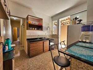 a kitchen with a sink and a counter top at Lar Doce Lar in Brumadinho