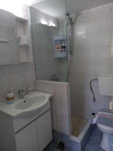 a bathroom with a shower and a sink and a toilet at Korasida Blue Coast in Akhladherí +36 photos