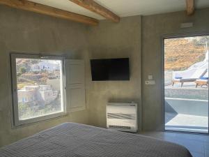 Letto o letti in una camera di Solo Sole Suites Santorini