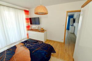 Ένα ή περισσότερα κρεβάτια σε δωμάτιο στο Apartament Muszelka 28 +1 φωτογραφίες