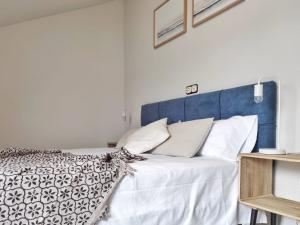 A bed or beds in a room at Playa de Raxó, al lado de Sanxenxo