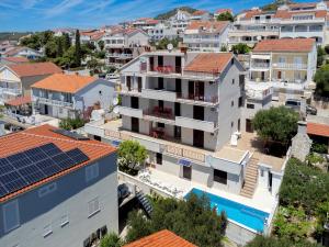 a view of a city with houses and a swimming pool at Villa M&M - ZF Hvar in Hvar