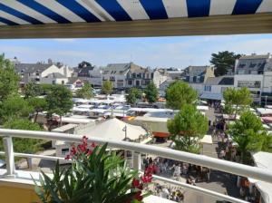 a view from the balcony of a shopping mall at duplex vue mer grande plage,coeur cente ville in Quiberon +2 photos