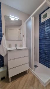 a bathroom with a sink and a shower at Diana Playa in Benalmádena +15 photos