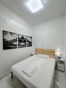 Postel nebo postele na pokoji v ubytování BED & BREAKFAST SAKURA