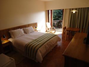 Ένα ή περισσότερα κρεβάτια σε δωμάτιο στο Hotel Passarim