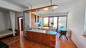 a kitchen with a sink and a counter top at Apartmán Bulvár in Žilina