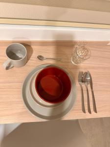 a plate sitting on a table with a fork and knife at Belmonte Studio 311 in Armenia +7 photos
