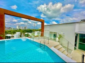 a swimming pool on the roof of a building at Belmonte Studio 311 in Armenia