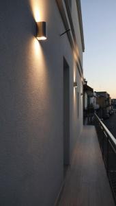 a hallway with lights on the side of a building at MAISON ANGELINA - Elegante Casa Vacanze in Puglia con Charme e Comfort in Grumo Appula
