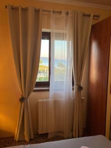 Postel nebo postele na pokoji v ubytování Apartman Adrijan