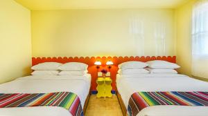 Postel nebo postele na pokoji v ubytování The Siesta Motel