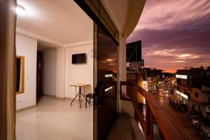 a balcony of a building with a view of a city at Hostal Los Balcones in Nazca