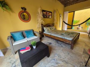 a living room with a couch and a table at Lujosa villa con piscina y cine privado in Melgar +21 photos