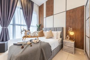 a bedroom with a bed with a wooden headboard at Trion Kuala Lumpur in Kuala Lumpur