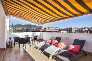 Ein Balkon oder eine Terrasse in der Unterkunft Sarria Attic