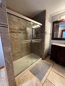a shower with a glass door in a bathroom at Paradise Acres Ranch in Nanoose Bay +41 photos