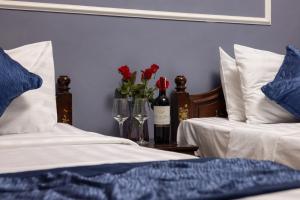 Postel nebo postele na pokoji v ubytování Amanda Boutique Hotel & Travel