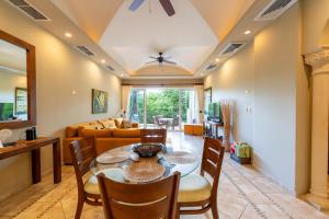 a dining room with a table and chairs at Matapalo 302- 2 Bedroom Condo At Tamarindo in Tamarindo