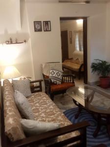 a living room with a couch and a table at Padamadan homestay in Cochin
