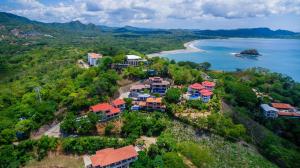 an aerial view of a resort next to a beach at Apartamento Del Mar in Playa Flamingo