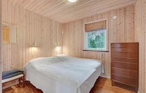 a bedroom with a bed and a dresser and a window at Pet Friendly Home In Fårvang With Wifi in Fårvang +27 photos