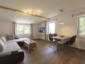 a living room with a couch and a table at 2 - Eilrich Comfortable holiday residence in Thiessow