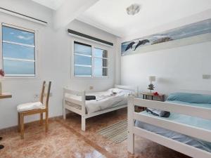 Postel nebo postele na pokoji v ubytování Spacious holiday home with private terrace