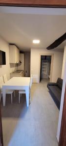 a living room with a white table and a couch at La Ponzianina in Spoleto