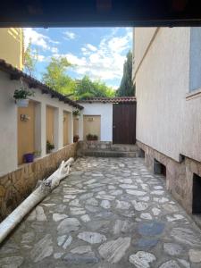 a courtyard of a house with a stone walkway at Deers in Bansko