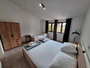 Postel nebo postele na pokoji v ubytování Apartmani Lisičina