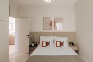 En eller flere senge i et værelse på Cozy Living Apartments Chania close to the beach