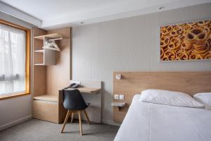 Postel nebo postele na pokoji v ubytování Brit Hotel Mulhouse Centre
