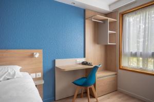 Postel nebo postele na pokoji v ubytování Brit Hotel Mulhouse Centre
