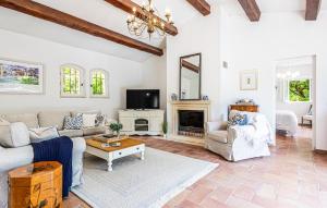 a living room with a couch and a fireplace at Stunning Home In Callian With Wifi in Callian